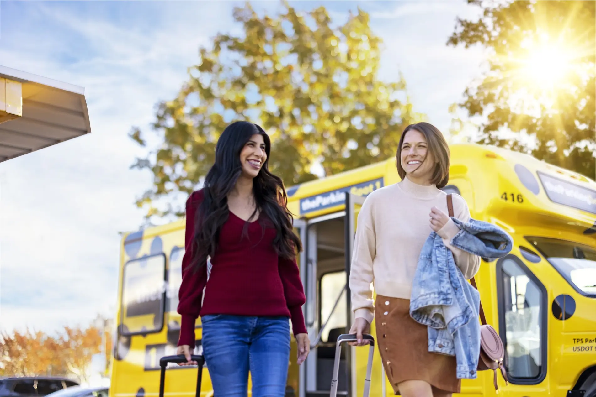 two women in front of a shuttle