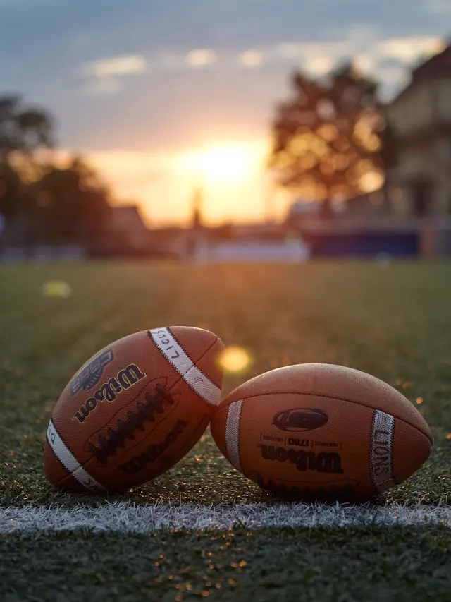 footballs on football field