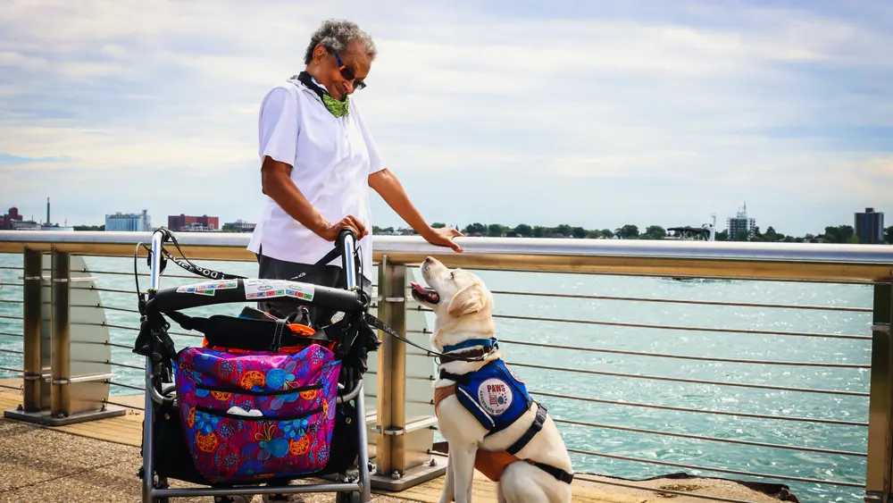 Vision impaired women traveling with a service dog.