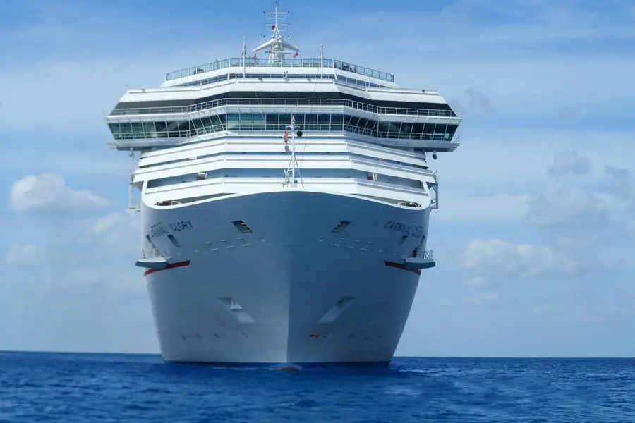 A large cruise ship at sea, looking at the prow as the ship appears to sail toward us.